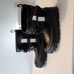 Ugg black patent leather boots size 6 faux fur on the inside waterproof features